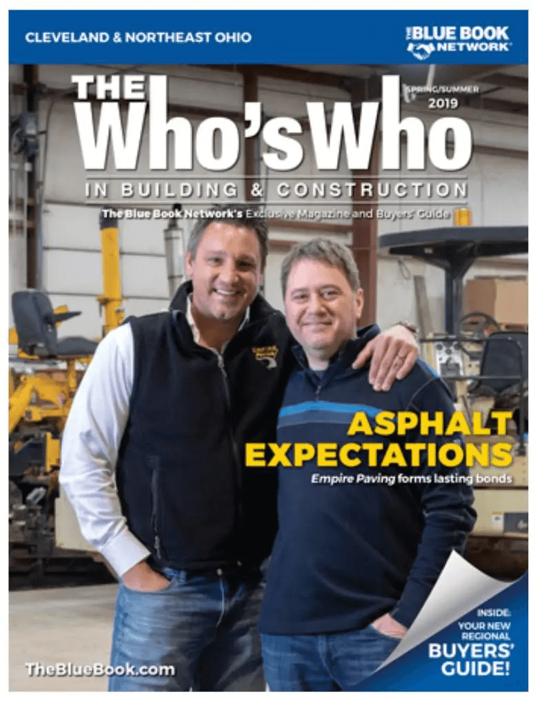 Two men stand smiling with arms around each other in a workshop, featured on the cover of a building and construction magazine titled “The Who’s Who.” Headline reads “Asphalt Expectations,” highlighting Ohio paving and construction expertise. Equipment is visible behind them.